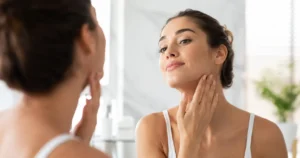 Person showing visible face fat reduction and sharper jawline