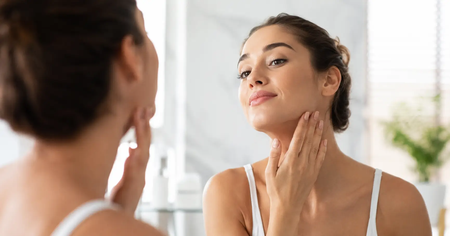 Person showing visible face fat reduction and sharper jawline